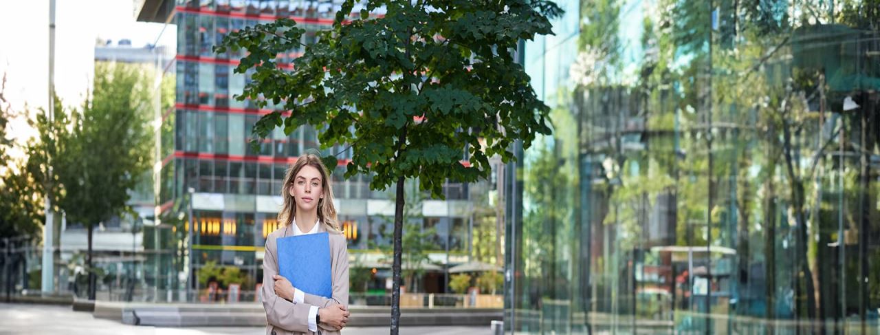 university student girl standing on campus building