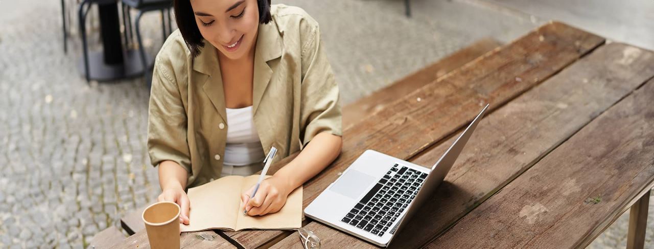 Student girl writing on a desk